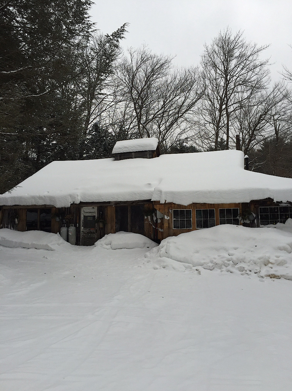 exterior of sugar house covered in snow